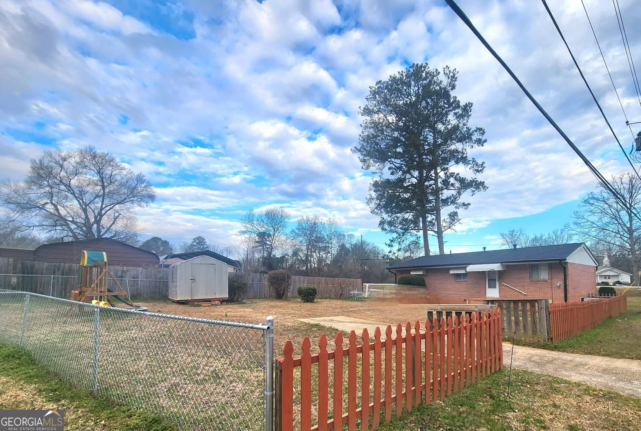 1026 Jackson Road Griffin, GA 30223 - Photo 20 of 21 a view of a house with a wooden fence