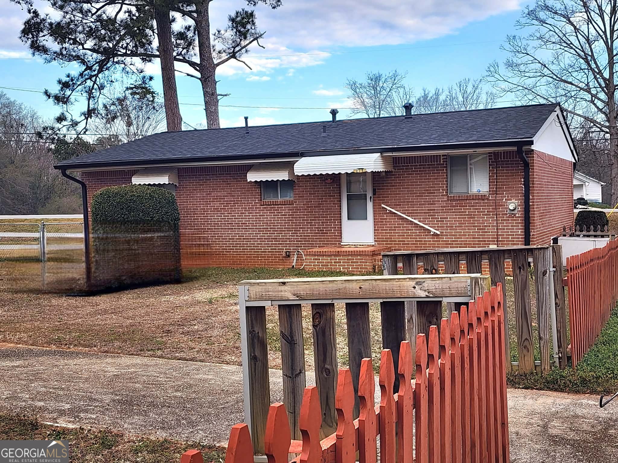 1026 Jackson Road Griffin, GA 30223 - Photo 21 of 21 a front view of a house with a tree