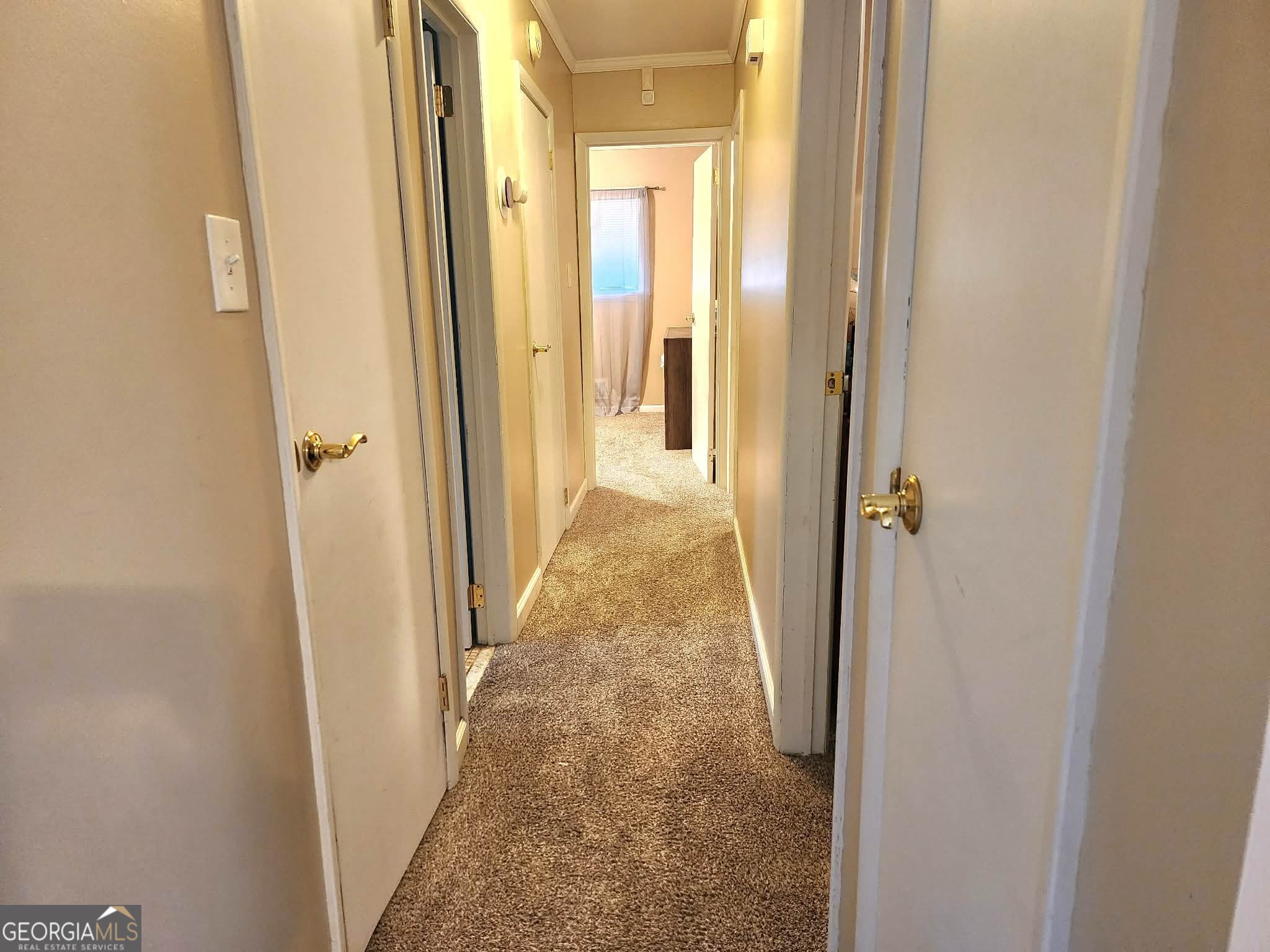 1026 Jackson Road Griffin, GA 30223 - Photo 10 of 21 a view of a hallway with a wooden door