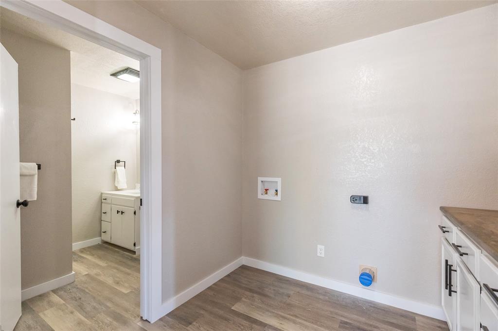 601 North Ave G Haskell, TX 79521 - Photo 11 of 36 a bathroom with a sink and a toilet