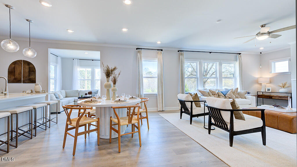 237 Tidal Pool Way Cary, NC 27519 - Photo 12 of 34 a view of a dining room with furniture window and wooden floor