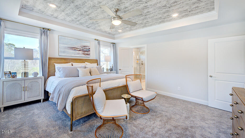 237 Tidal Pool Way Cary, NC 27519 - Photo 23 of 34 a bedroom with a bed and a chandelier