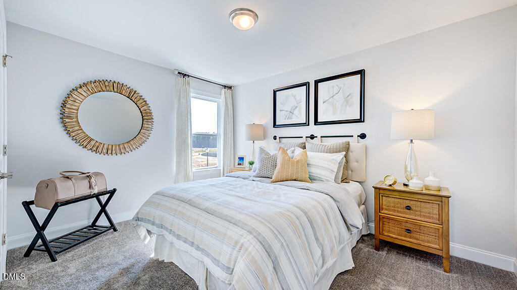 237 Tidal Pool Way Cary, NC 27519 - Photo 29 of 34 a bedroom with a bed a mirror and a window