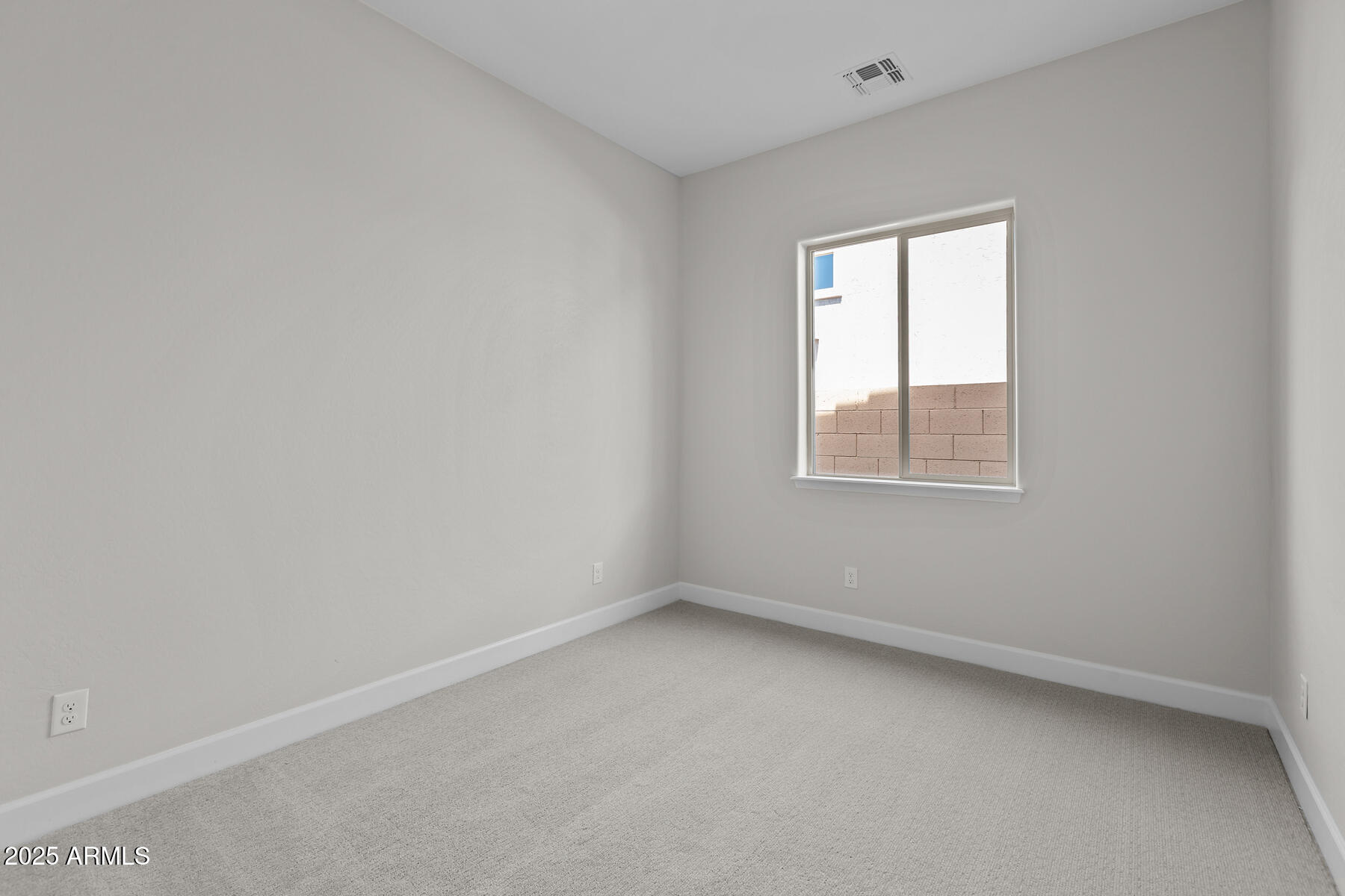 1042 Ridge Road Apache Junction, AZ 85120 - Photo 14 of 27 an empty room with a window
