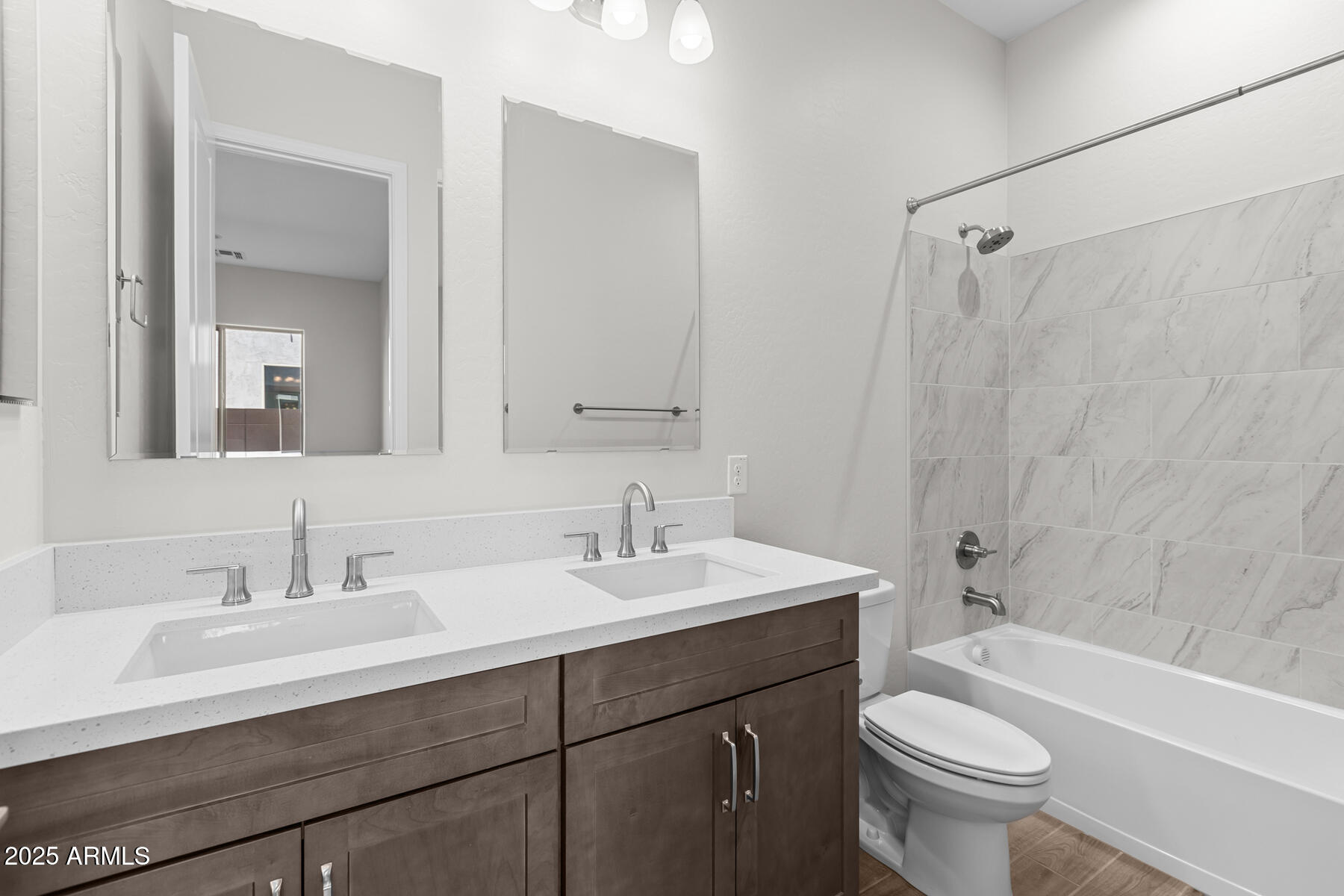 1042 Ridge Road Apache Junction, AZ 85120 - Photo 15 of 27 a bathroom with a sink toilet a mirror and shower