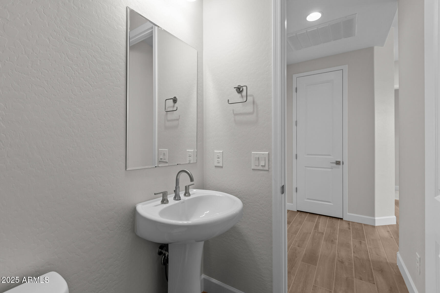 1042 Ridge Road Apache Junction, AZ 85120 - Photo 17 of 27 a bathroom with a sink and a mirror