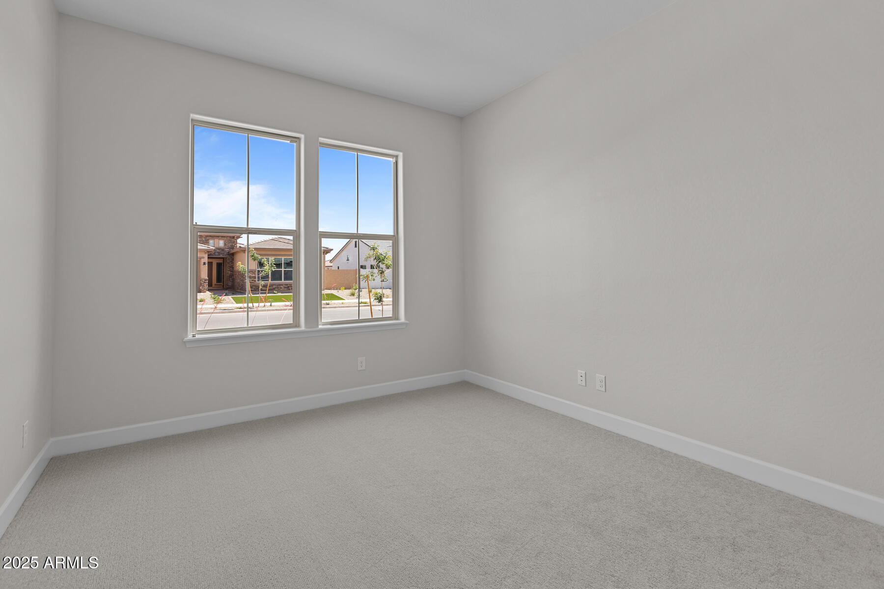 1042 Ridge Road Apache Junction, AZ 85120 - Photo 18 of 27 an empty room with windows