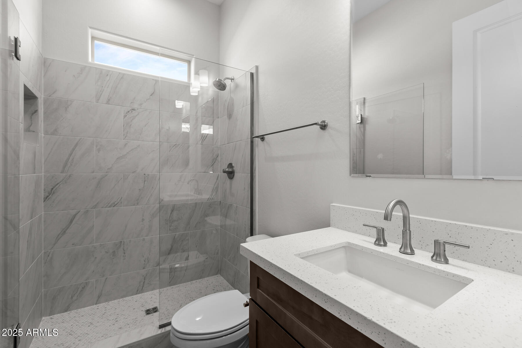 1042 Ridge Road Apache Junction, AZ 85120 - Photo 19 of 27 a bathroom with a sink toilet and shower