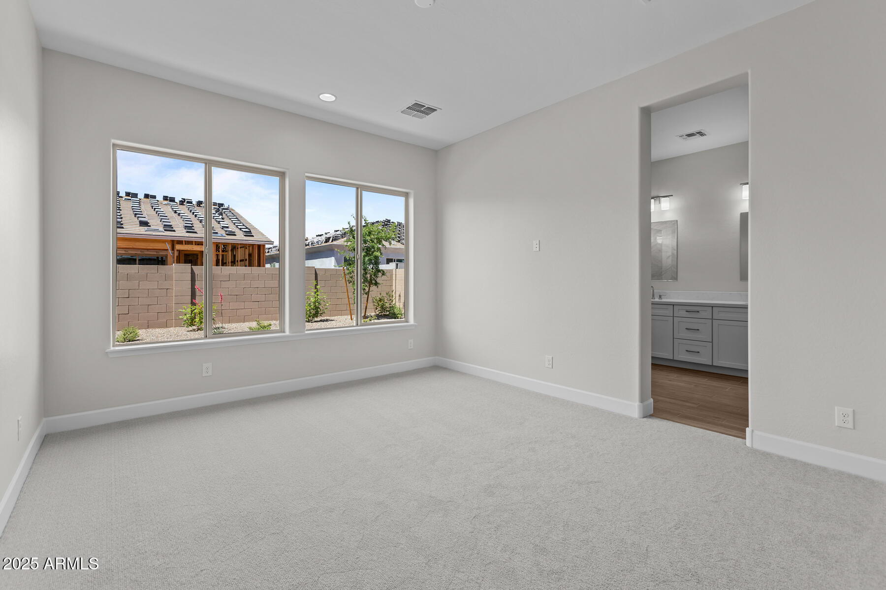 1042 Ridge Road Apache Junction, AZ 85120 - Photo 9 of 27 wooden floor in an empty room with a window