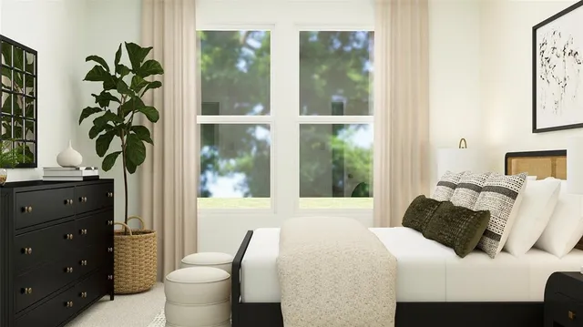 a bedroom with a bed and a potted plant