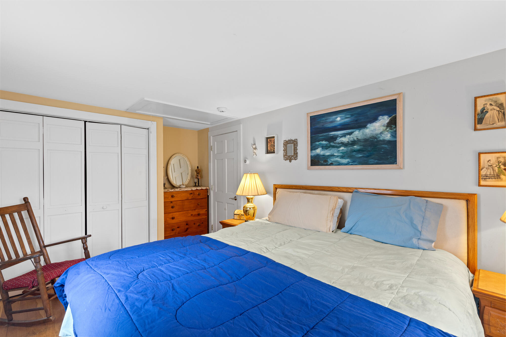 311 South Sunken Meadow Road Eastham, MA 02642 - Photo 24 of 57 a bedroom with a bed and wooden floor