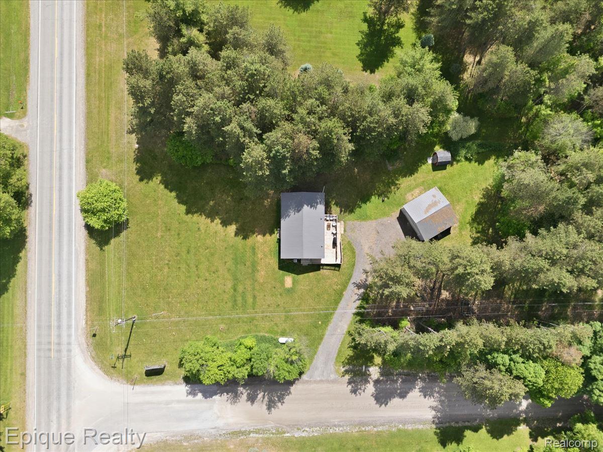 12272 East Mt Morris Road Davison, MI 48423 - Photo 39 of 39 Aerial perspective showcasing a single-story dwelling with a gray roof and an attached deck