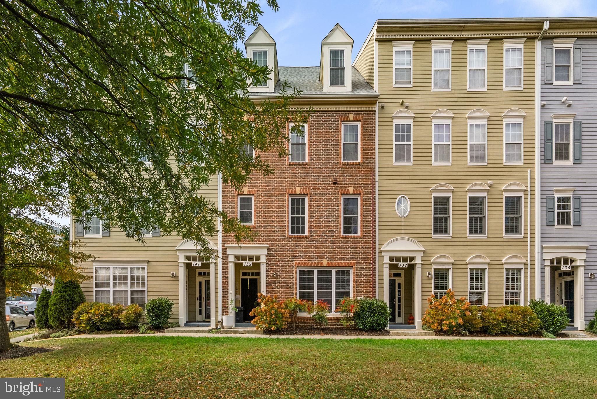 139 Chevy Chase Street, Unit 139 Gaithersburg, MD 20878 - Photo 1 of 27 front view of a house with a yard