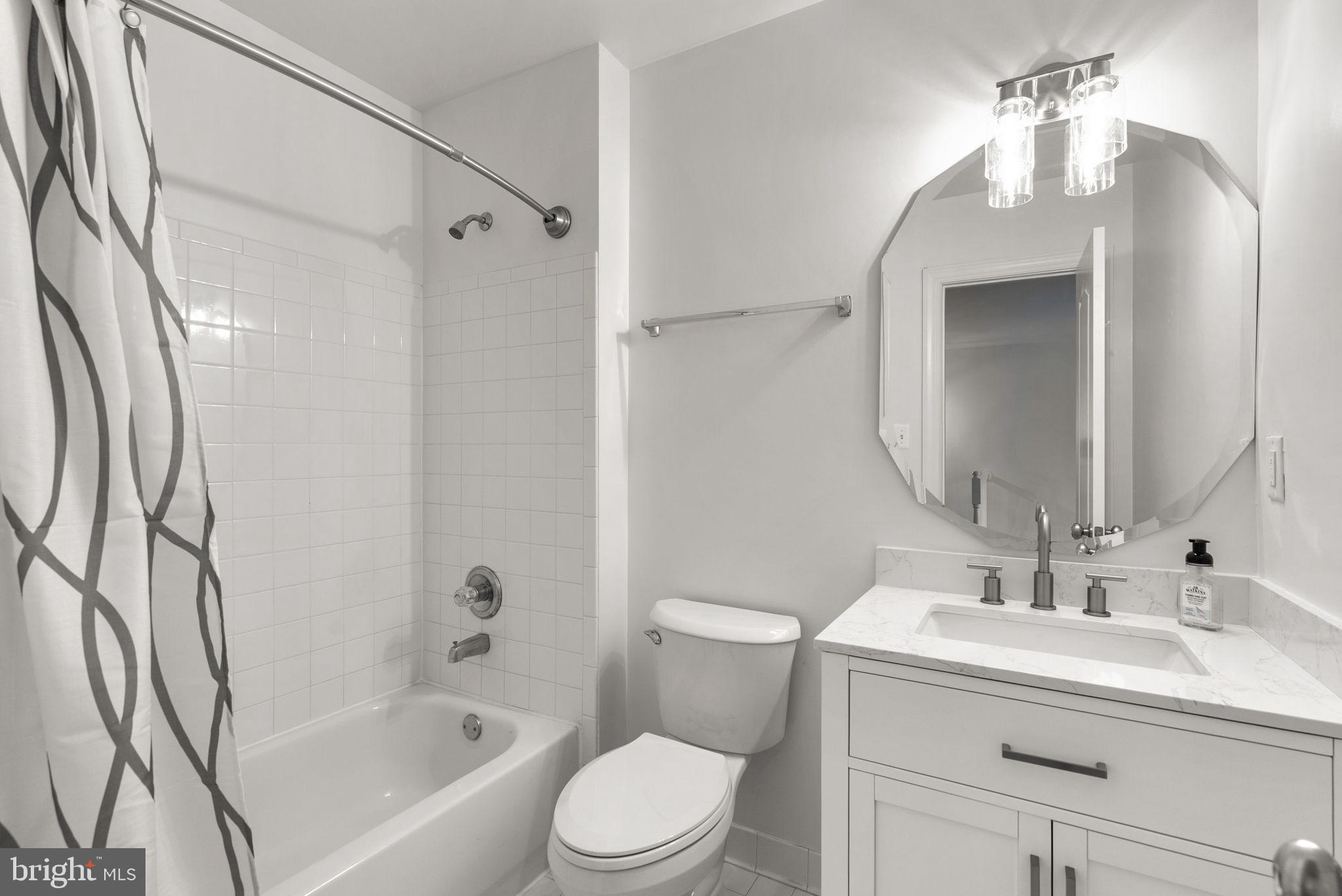 139 Chevy Chase Street, Unit 139 Gaithersburg, MD 20878 - Photo 19 of 27 a bathroom with a sink toilet and shower