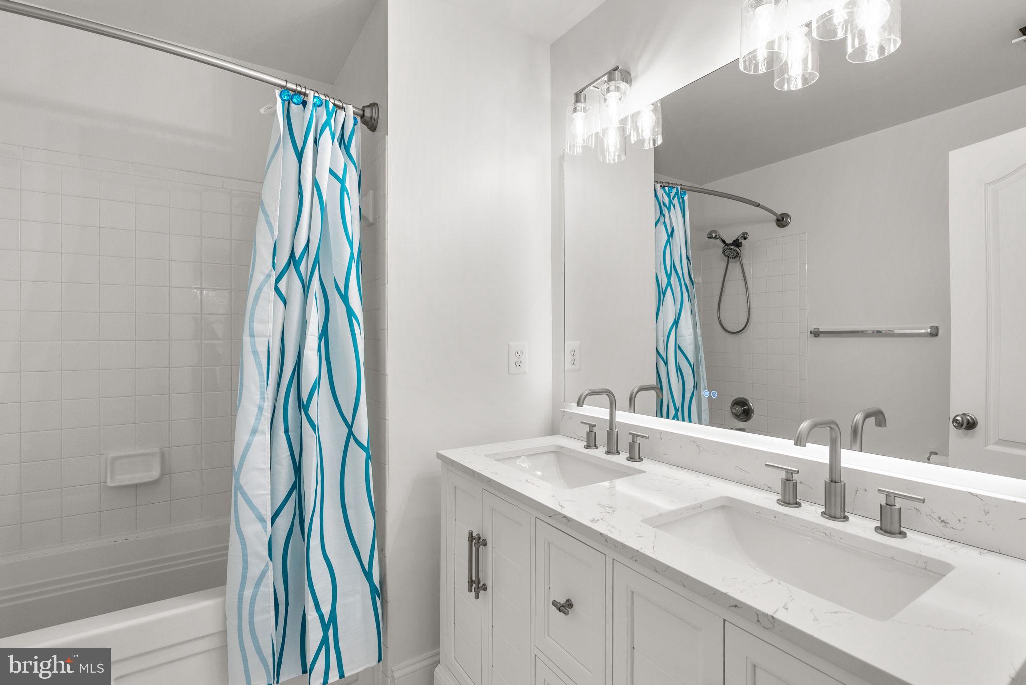 139 Chevy Chase Street, Unit 139 Gaithersburg, MD 20878 - Photo 21 of 27 a bathroom with a sink and a mirror