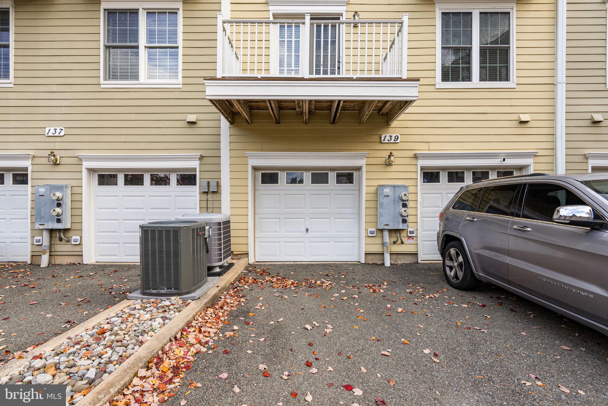 139 Chevy Chase Street, Unit 139 Gaithersburg, MD 20878 - Photo 25 of 27 a view of a house with a parking space