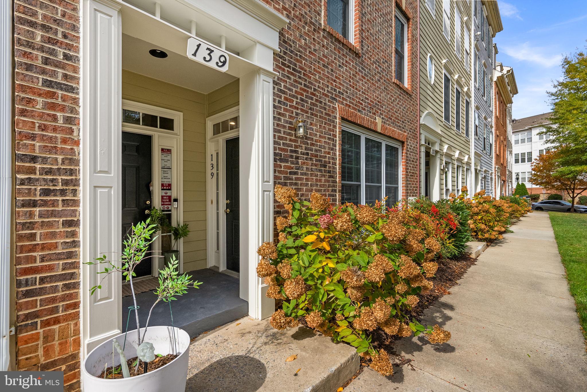 139 Chevy Chase Street, Unit 139 Gaithersburg, MD 20878 - Photo 3 of 27 a flower plants in front of a building