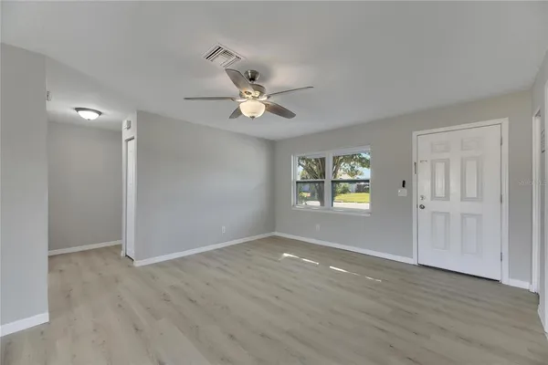 a kitchen with granite countertop white cabinets stainless steel appliances and a sink