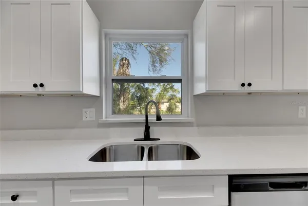 a bathroom with a sink vanity and a mirror