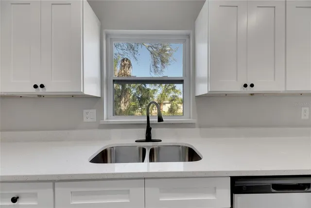 a bathroom with a sink vanity and a mirror