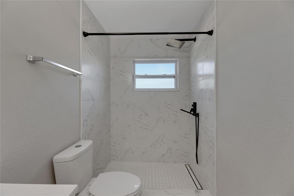 527 Fox Run Trail Apollo Beach, FL 33572 - Photo 29 of 73 a bathroom with a toilet and a shower