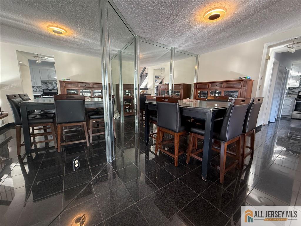 105 Westgate Drive, Unit 105 Edison, NJ 08820 - Photo 12 of 28 a view of a dining room with furniture