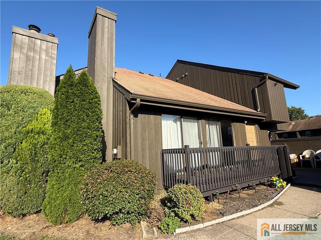 105 Westgate Drive, Unit 105 Edison, NJ 08820 - Photo 2 of 28 a backyard of a house with a small yard