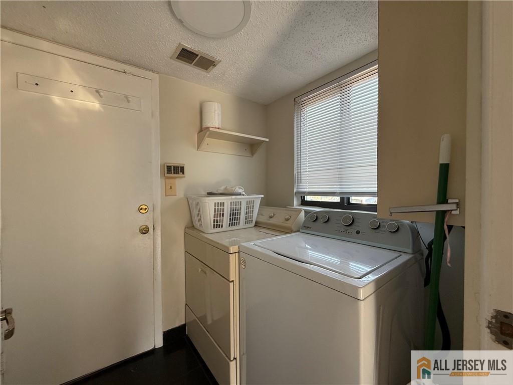 105 Westgate Drive, Unit 105 Edison, NJ 08820 - Photo 23 of 28 a bathroom with a sink and a mirror