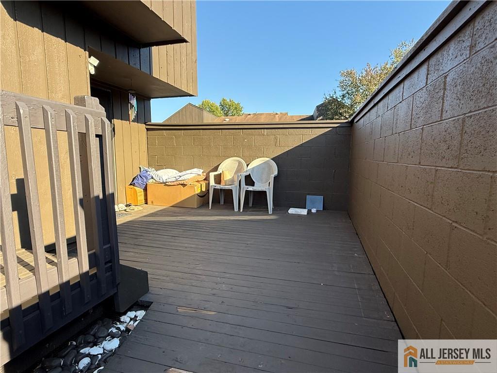 105 Westgate Drive, Unit 105 Edison, NJ 08820 - Photo 25 of 28 a view of a balcony with chairs