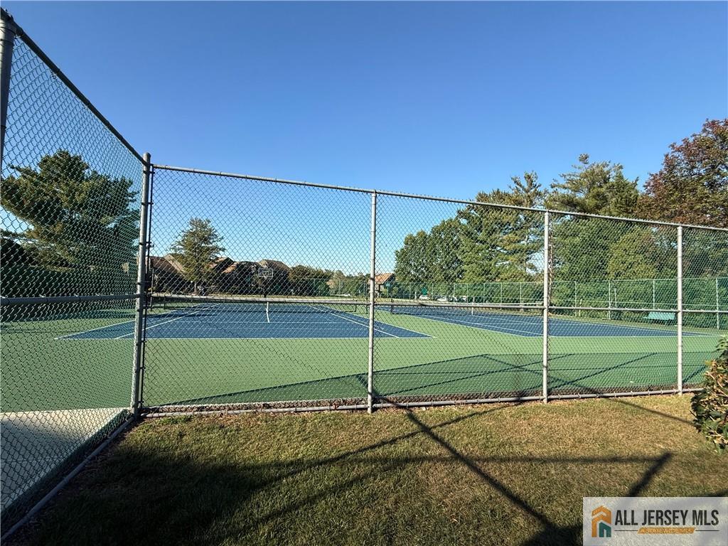 105 Westgate Drive, Unit 105 Edison, NJ 08820 - Photo 26 of 28 a view of a tennis court
