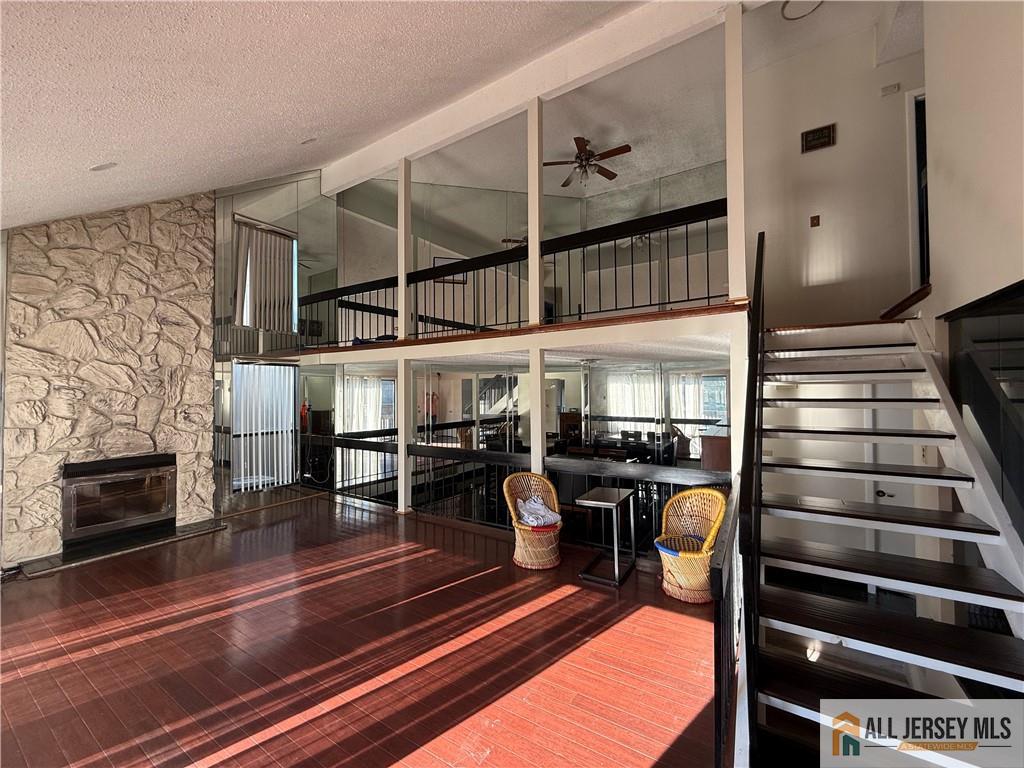 105 Westgate Drive, Unit 105 Edison, NJ 08820 - Photo 4 of 28 a view of a dining room with furniture a fireplace and chandelier