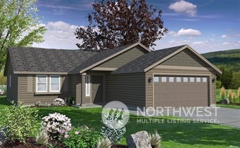 1712 North Hemlock Road Moses Lake, WA 98837 - Photo 1 of 1 a front view of a house with garden
