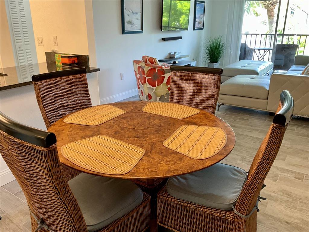 3213 South Beneva Road, Unit 204 Sarasota, FL 34232 - Photo 6 of 18 view of living room kitchen with furniture and wooden floor