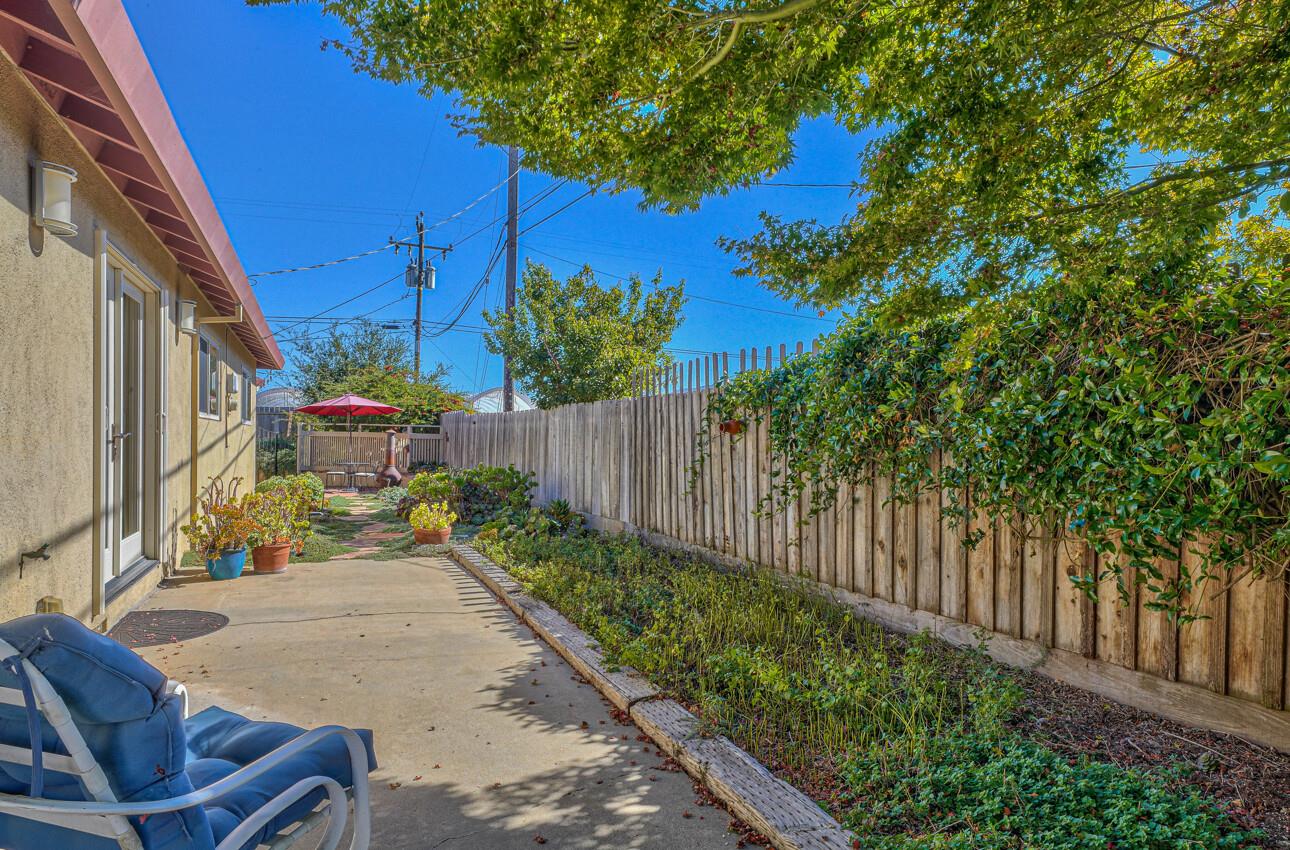 118 Enos Drive Salinas, CA 93908 - Photo 13 of 59 a view of a backyard with potted plants and wooden fence