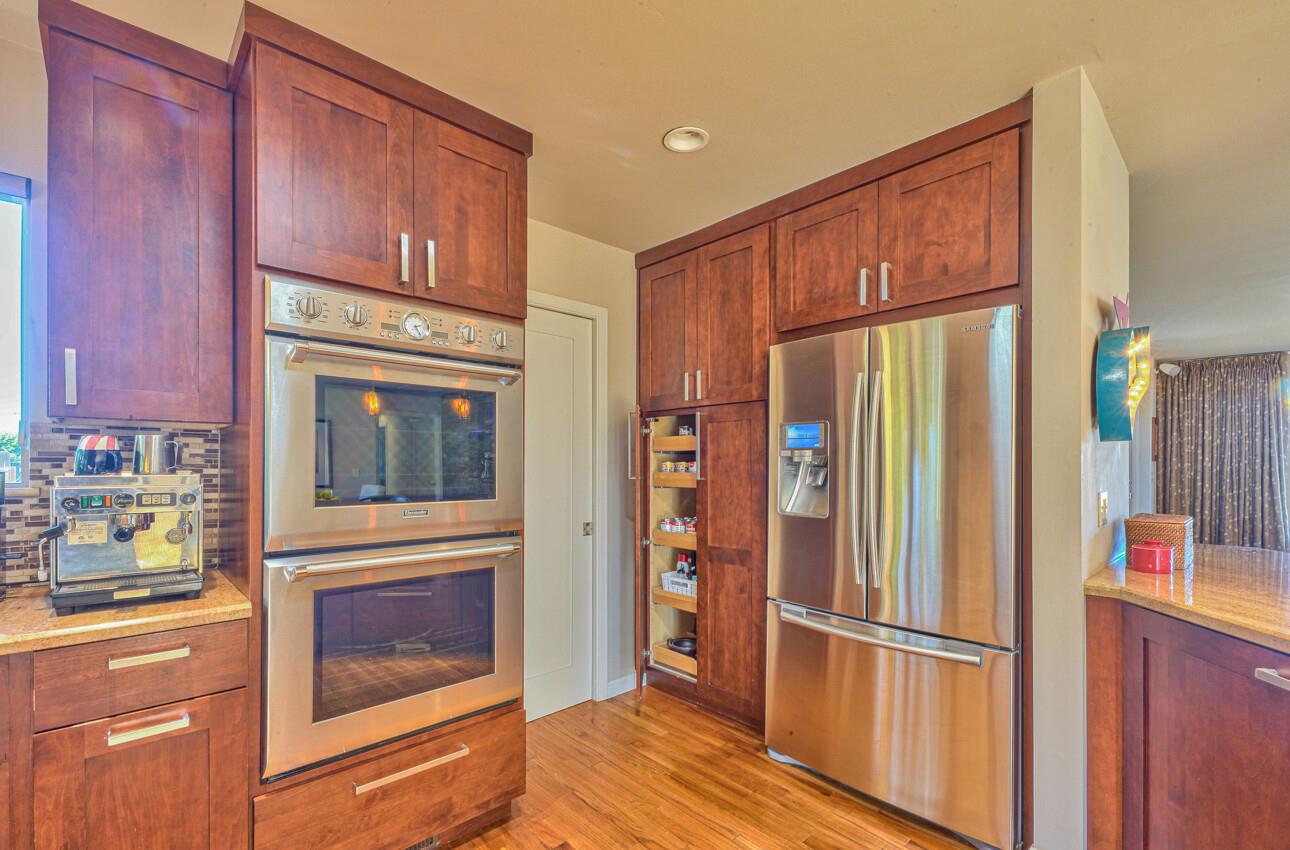 118 Enos Drive Salinas, CA 93908 - Photo 20 of 59 a kitchen with stainless steel appliances granite countertop a refrigerator and a stove top oven
