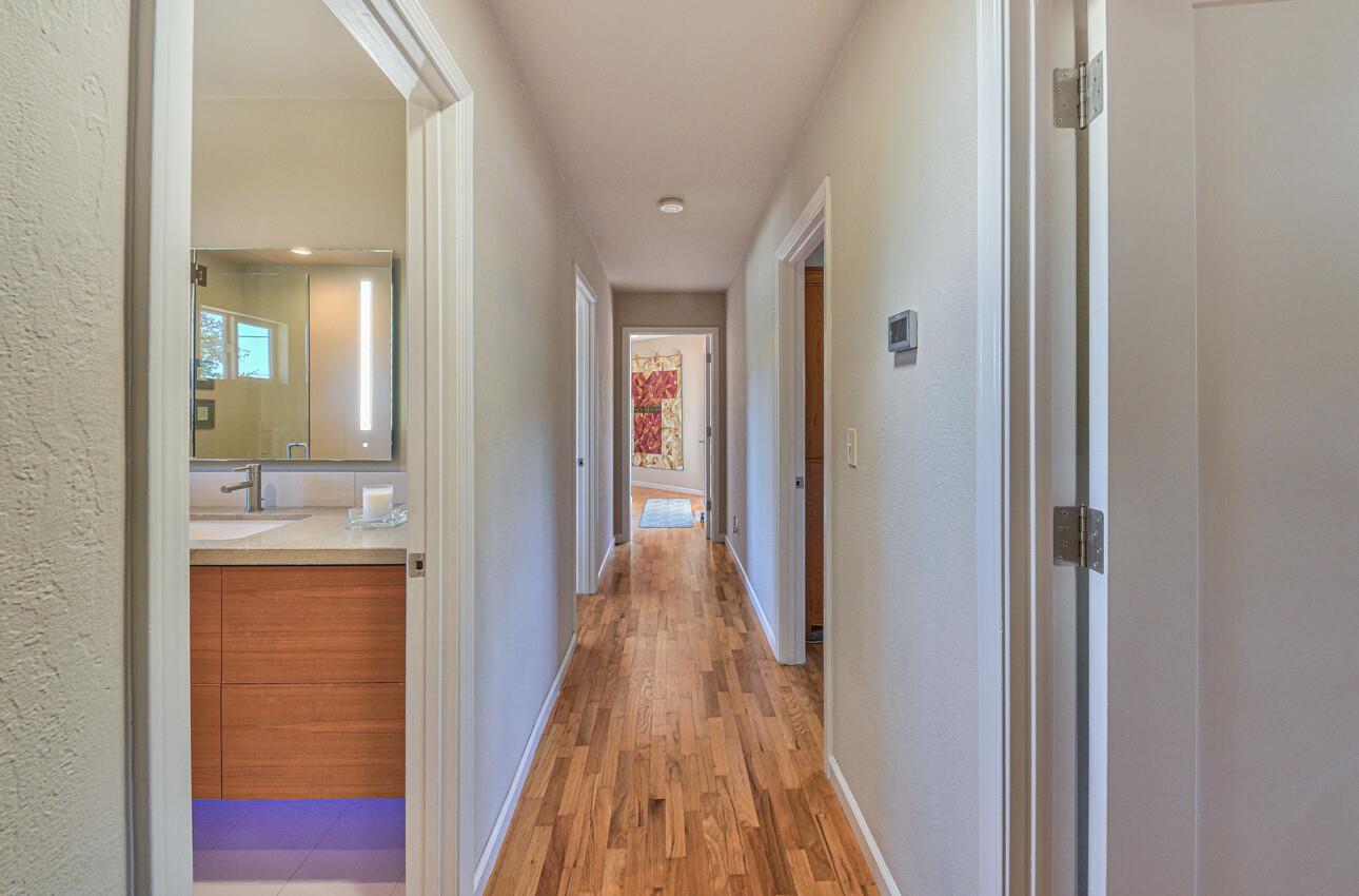 118 Enos Drive Salinas, CA 93908 - Photo 23 of 59 a view of a hallway with wooden floor and bathroom