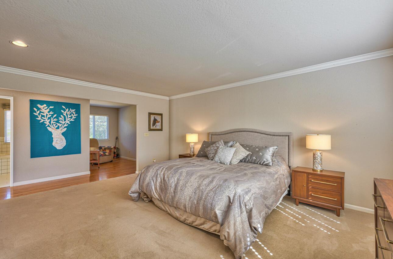 118 Enos Drive Salinas, CA 93908 - Photo 29 of 59 a bedroom with a large bed and a chandelier