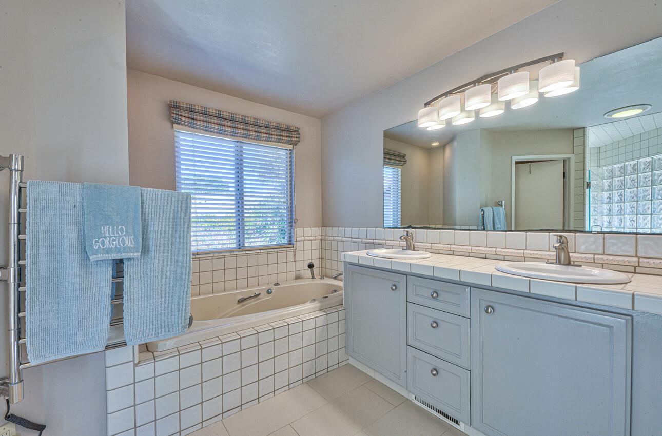 118 Enos Drive Salinas, CA 93908 - Photo 33 of 59 a spacious bathroom with a granite countertop sink mirror and a bathtub