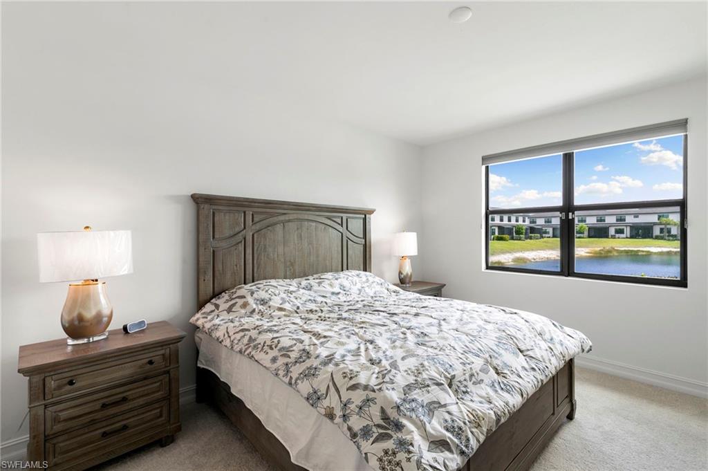 7572 Carnegie Way Naples, FL 34119 - Photo 17 of 43 a bedroom with a bed and a window