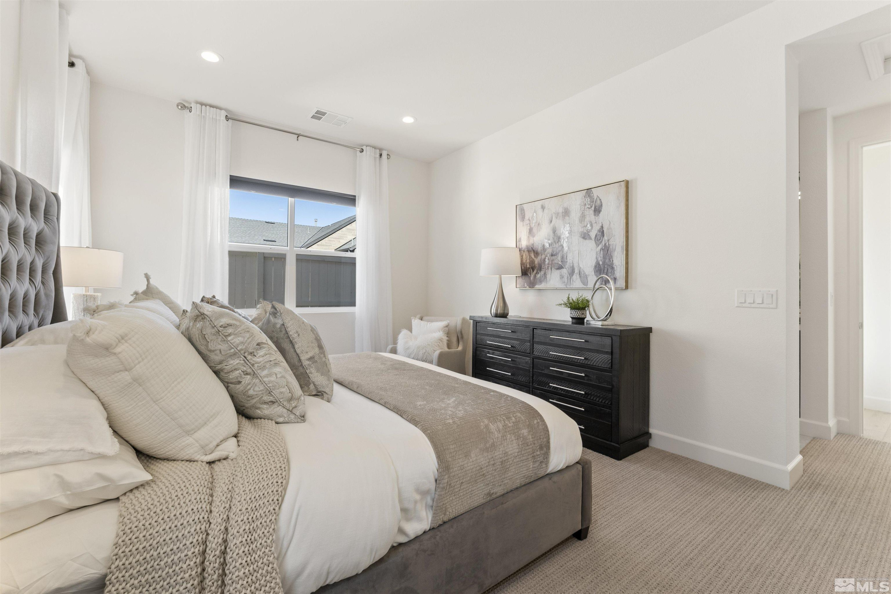 5421 Phillipa Drive Reno, NV 89511 - Photo 14 of 39 a bedroom with a bed and a painting