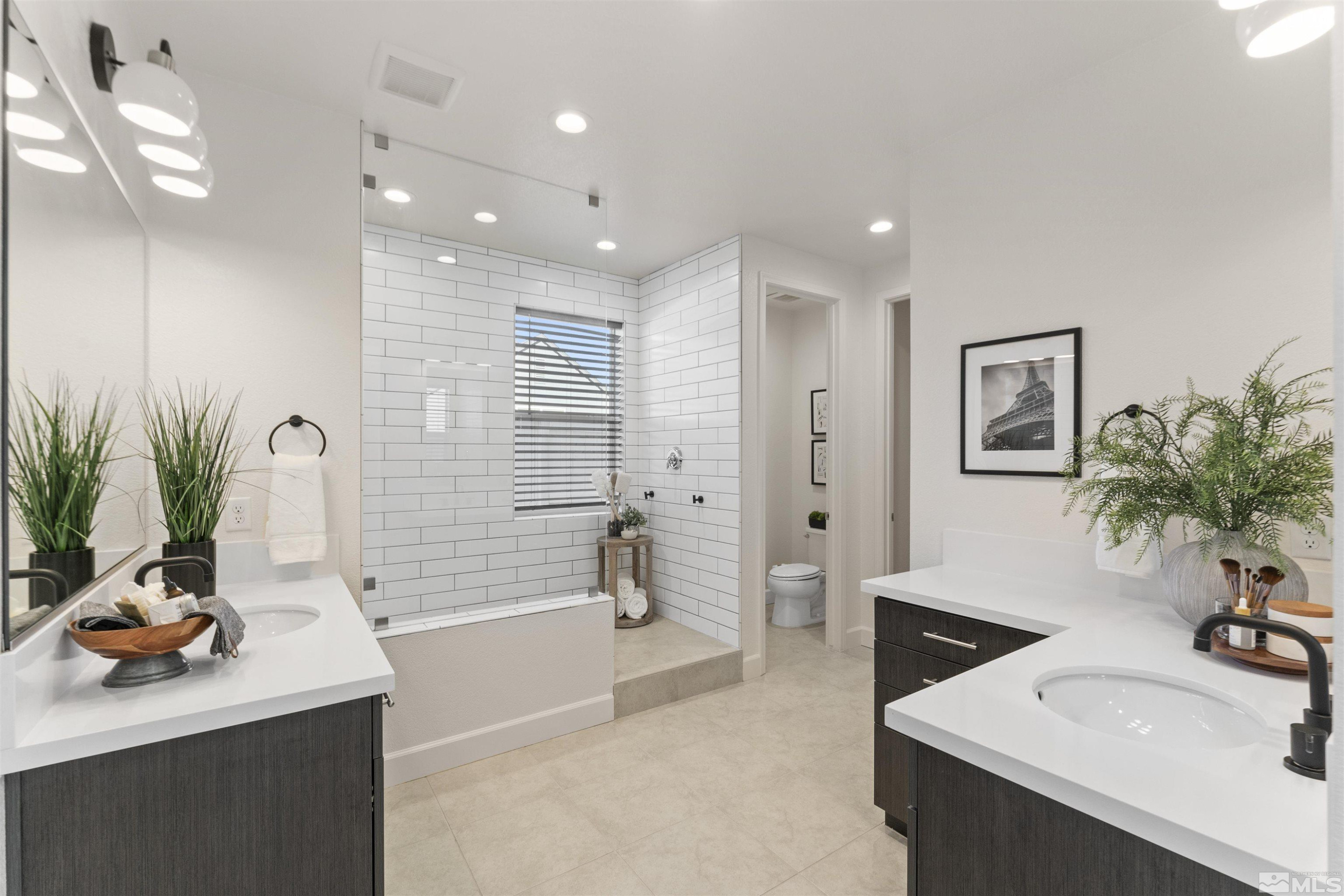 5421 Phillipa Drive Reno, NV 89511 - Photo 15 of 39 a bathroom with a sink a tub and a mirror