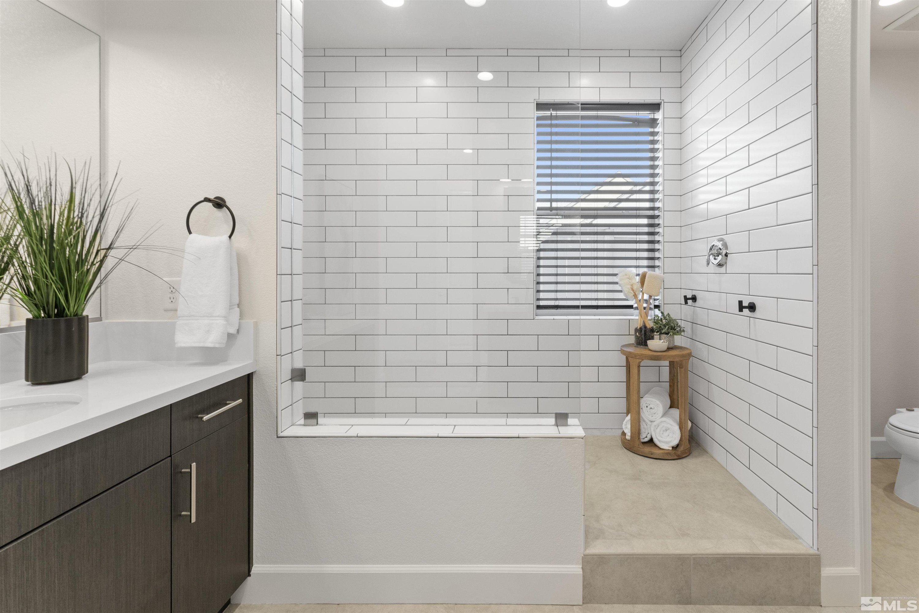 5421 Phillipa Drive Reno, NV 89511 - Photo 16 of 39 a bathroom with a shower and a sink