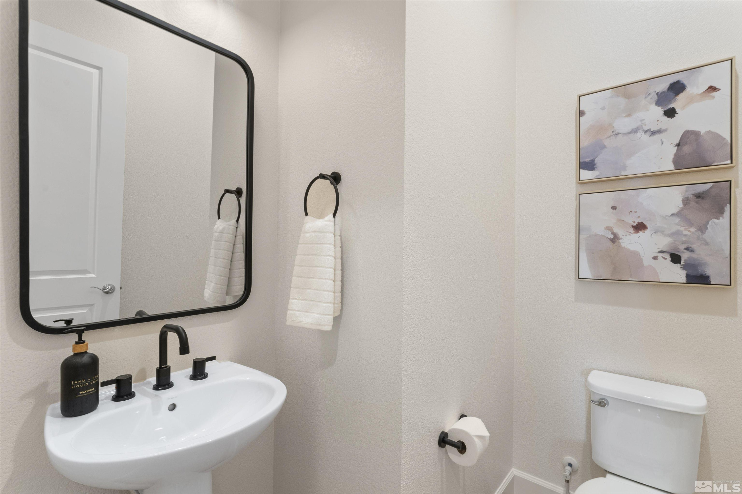 5421 Phillipa Drive Reno, NV 89511 - Photo 21 of 39 a bathroom with a sink and mirror with toilet