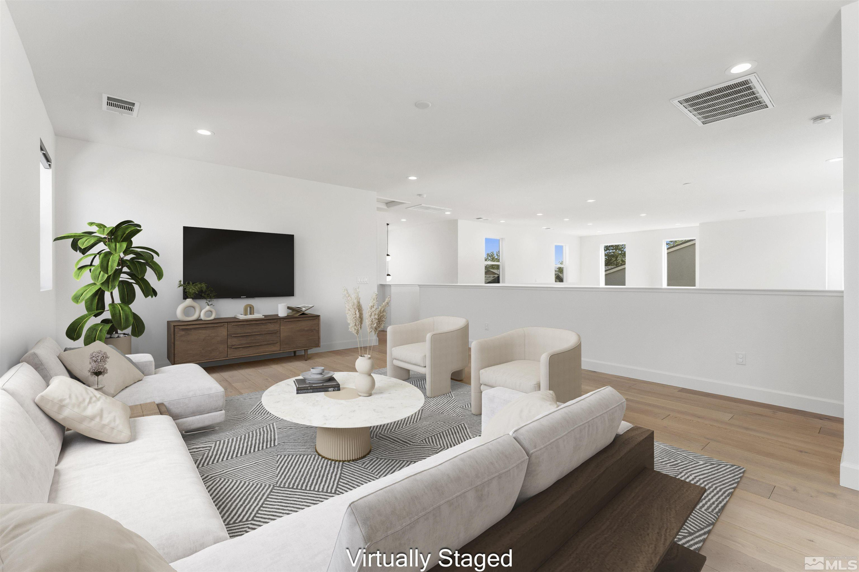 5421 Phillipa Drive Reno, NV 89511 - Photo 23 of 39 a living room with furniture and a flat screen tv