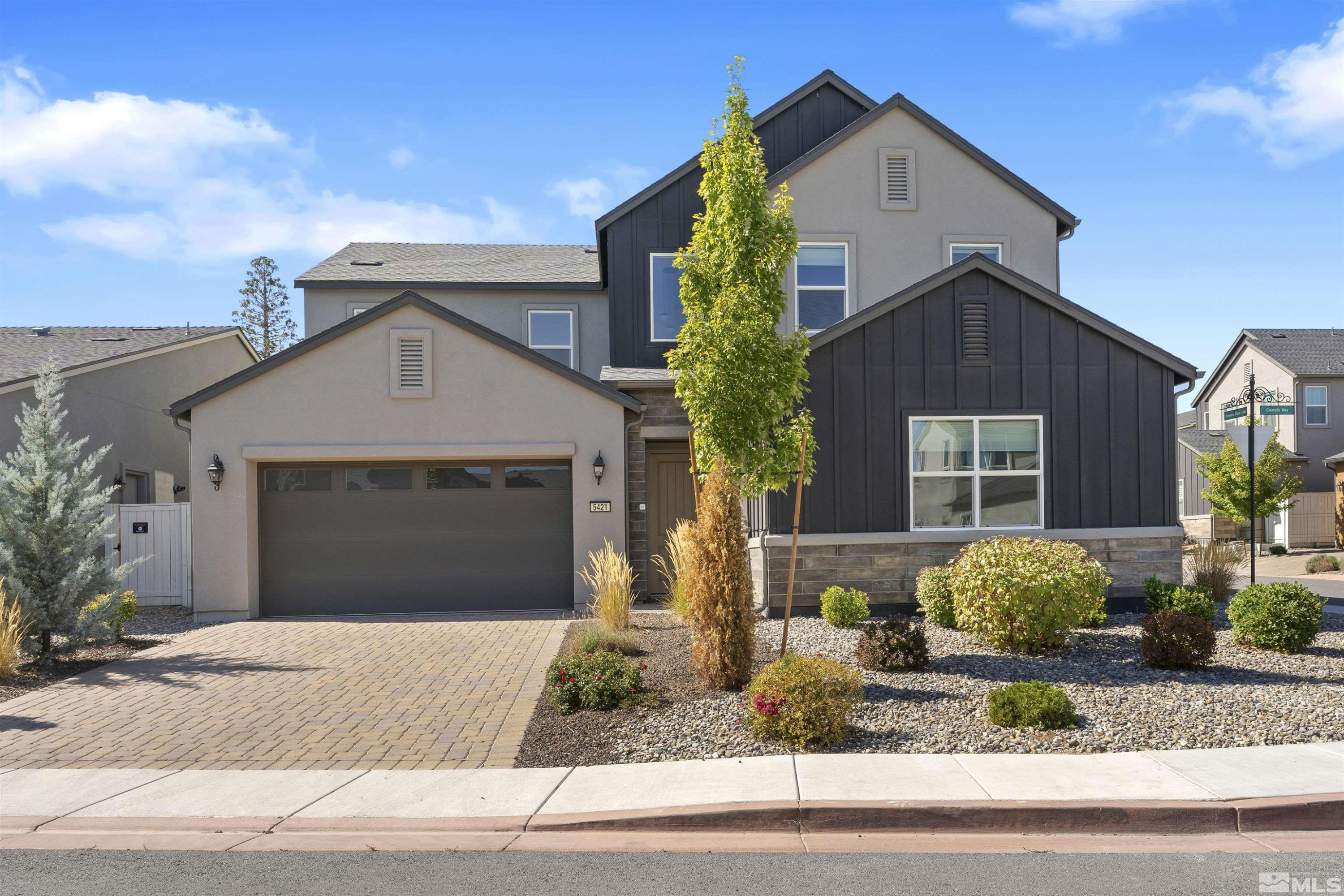 5421 Phillipa Drive Reno, NV 89511 - Photo 30 of 39 a front view of a house with garage and plants