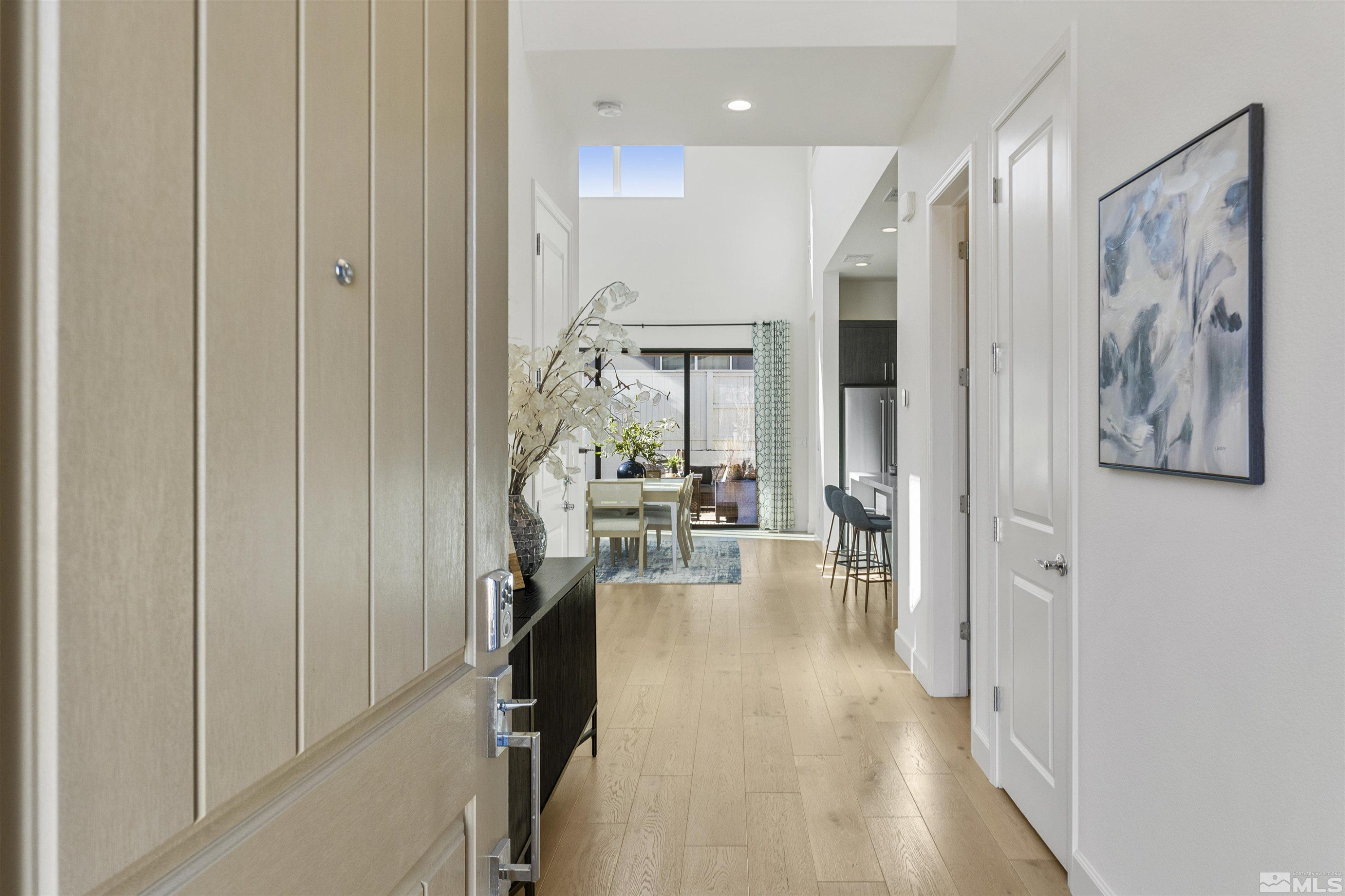 5421 Phillipa Drive Reno, NV 89511 - Photo 3 of 39 a view of a hallway with wooden floor windows and livingroom view