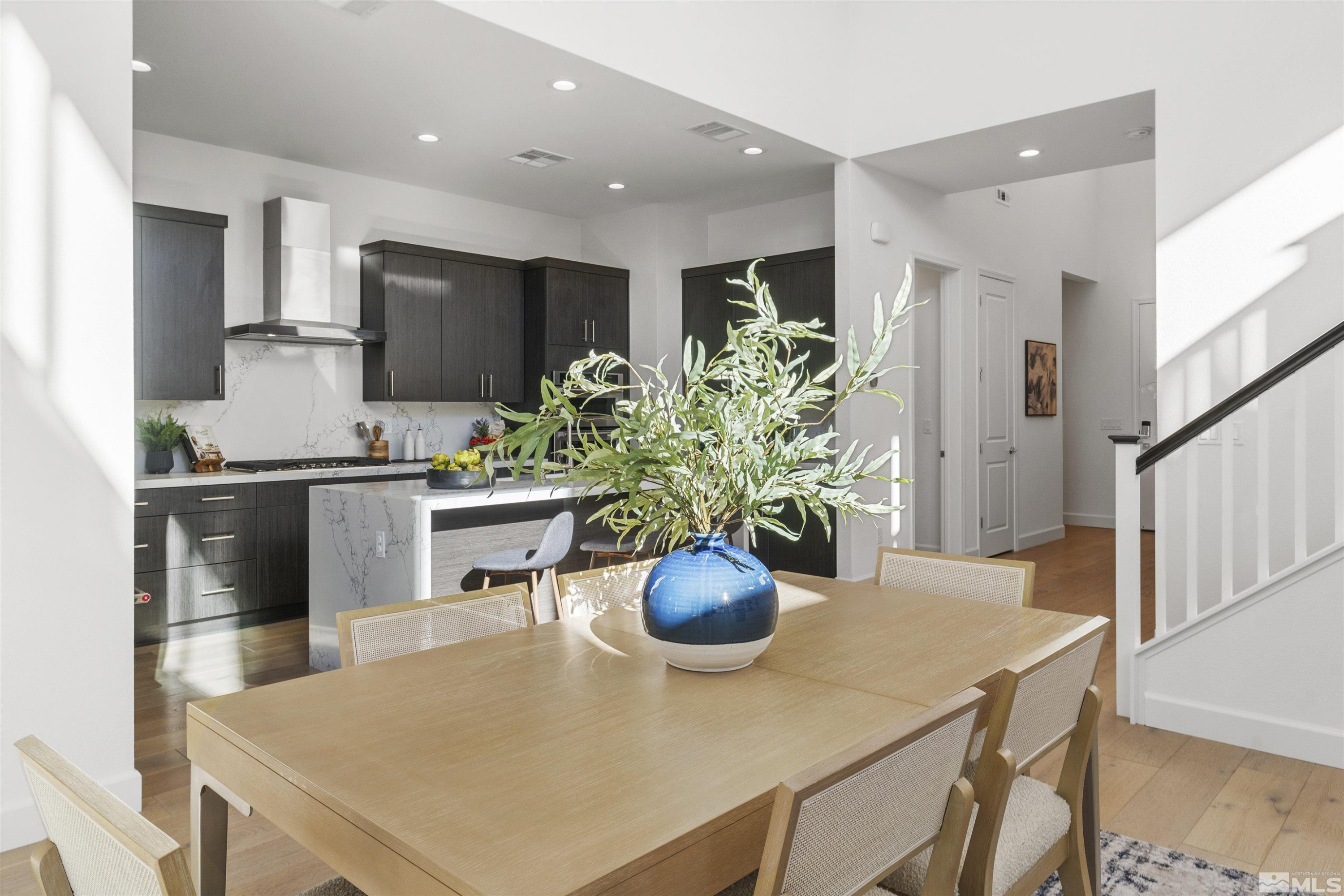 5421 Phillipa Drive Reno, NV 89511 - Photo 8 of 39 a kitchen with stainless steel appliances a dining table chairs and refrigerator