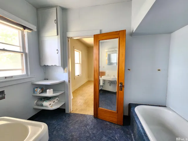 a en suite bathroom with a tub toilet and sink