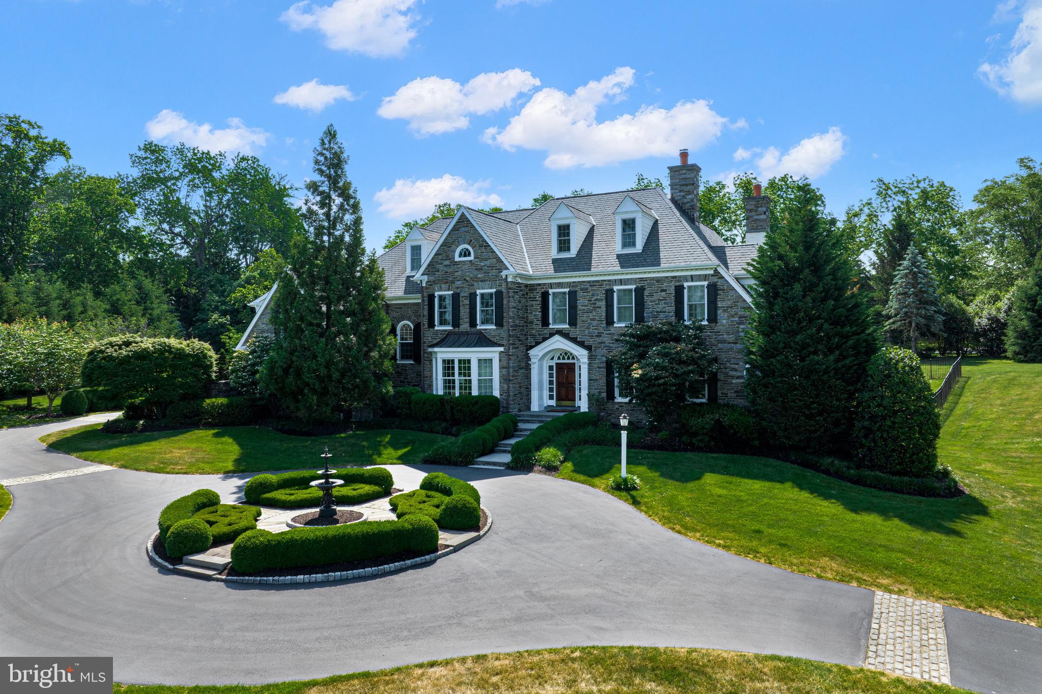 318 Winfield Road Devon, PA 19333 - Photo 18 of 97 a front view of a house with a yard and trees