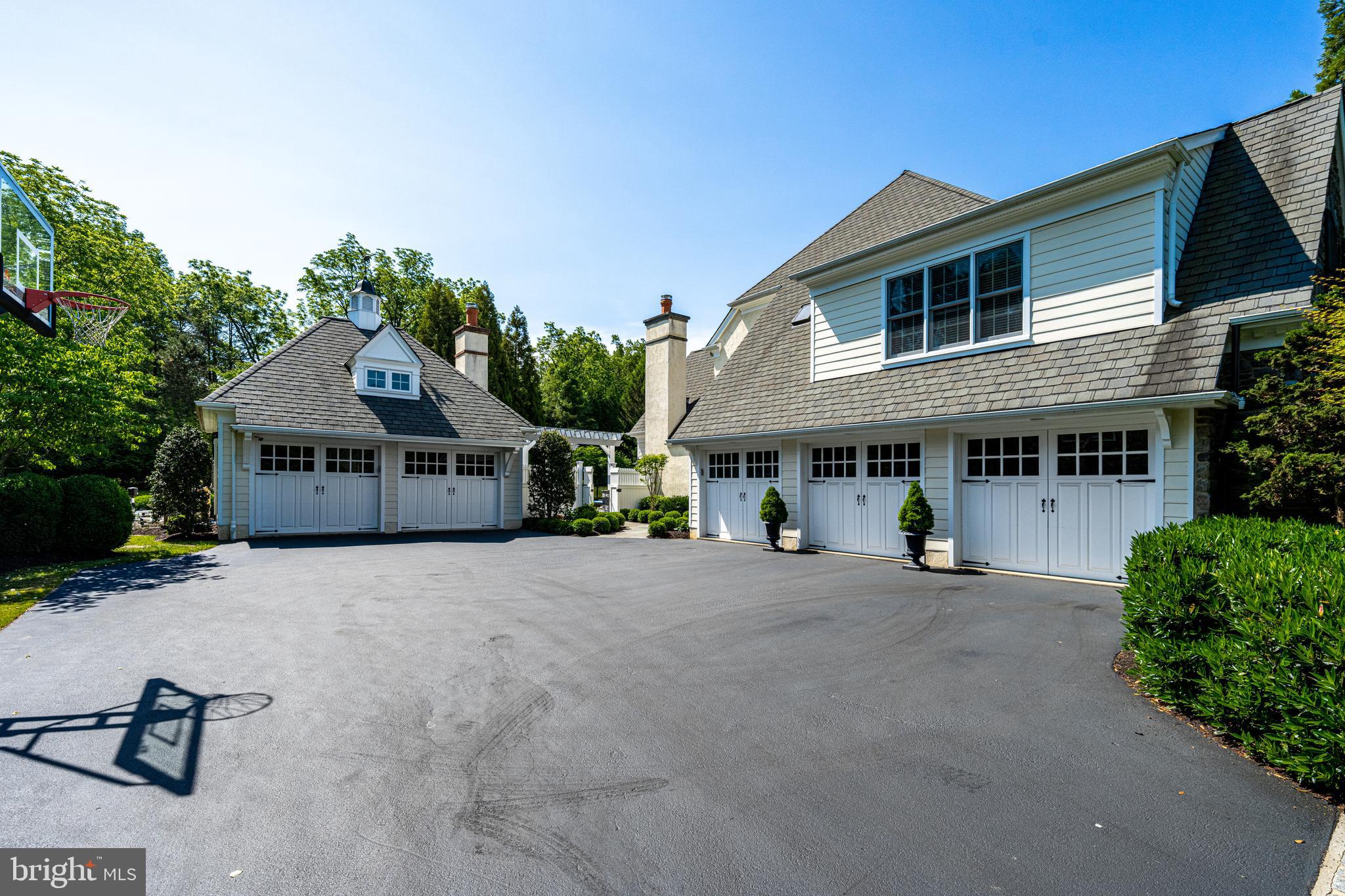 318 Winfield Road Devon, PA 19333 - Photo 20 of 97 a front view of a house with yard and parking